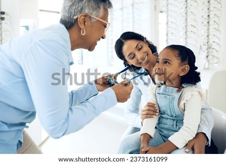 Optical, glasses and optometrist with child and mother at an eye care appointment for test. Health, wellness and senior optician with young mom and girl kid patient with lenses in an optometry clinic