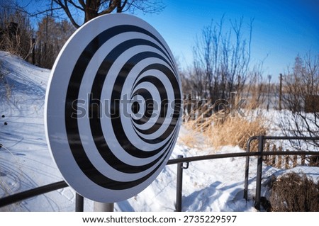 Optical illusion - on a flat surface, thanks to uneven concentric lines, we see a three-dimensional object.