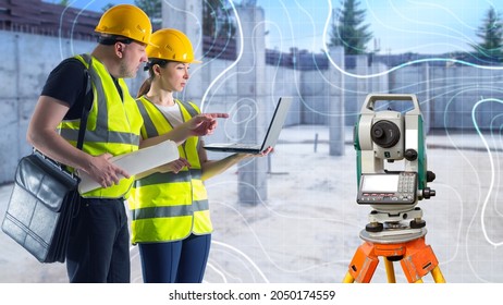 Optical Level Near By Two Surveyors. Engineering And Geological Surveys. Topographic Survey. Construction Site Topography. Surveyors With Modern Theodelites. Geodetic Works. Blurred Background.