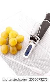 Optical refractometer for measuring grape sugar in the production of wine and spirits. Selective focus with shallow depth of field.