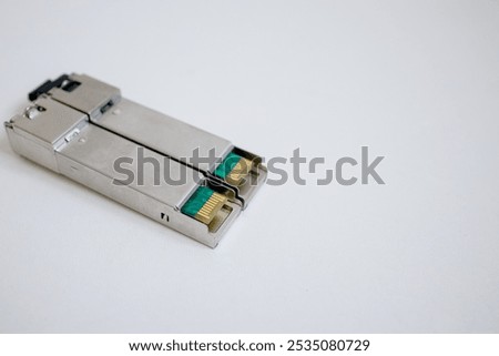 optical transceiver modules on a plain background