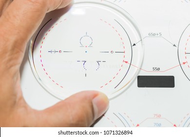 Optician Male Check Power Lens Progressive Len,raw Material On The Digital Device In Optical Store.