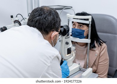 Optician Measuring A Woman's Eyesight