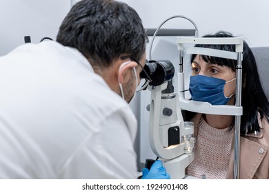 Optician Measuring A Woman's Eyesight