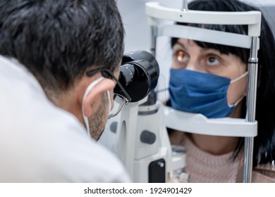 Optician Measuring A Woman's Eyesight