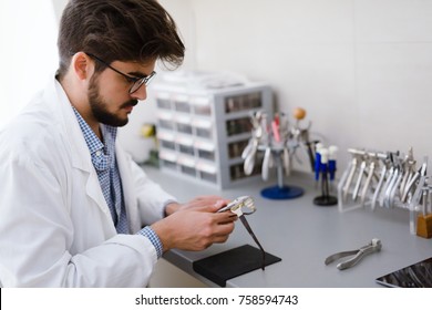 Optician Repairing And Fixing Eye Glasses