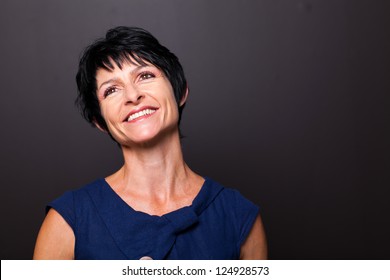 Optimistic Middle Aged Woman Portrait On Black Background