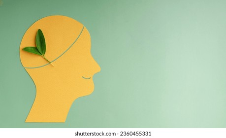Optimistic Mind, Harmony and Environmentalism Person Concept. made by Paper and Real Green Leaf. Conceptual Photo of Mental Health