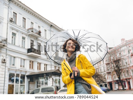 Similar – Woman Walking Through Building