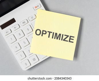 Optimize Word On Paper Note. Cost And Tax Optimization In Business.