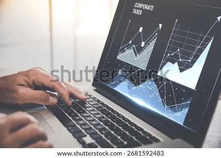 Optimizing Business Strategy: A Professional Analyzing Financial Data and Tax Rates on a Laptop
