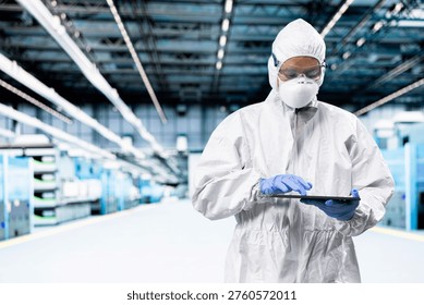 Optimizing photolithography process, tablet and engineer man inspecting semiconductor production infrastructure. Trialing advanced silicon wafers materials, device and researcher