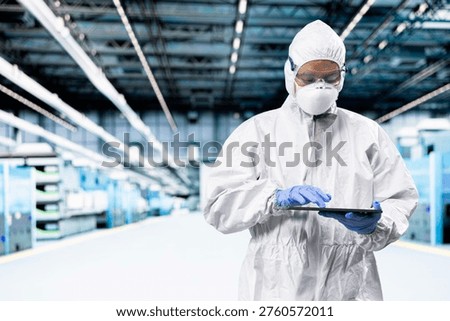Optimizing photolithography process, tablet and engineer man inspecting semiconductor production infrastructure. Trialing advanced silicon wafers materials, device and researcher