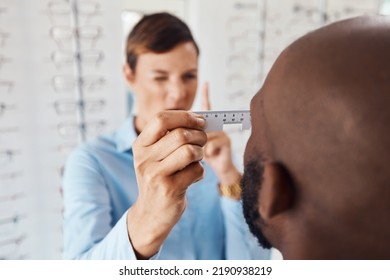 Optometrist, Doctor And Specialist Checking Vision Retina Measurement And Sight Of A Patient With Optical PD Ruler During Eye Test In A Clinic. Eye Doctor Giving Treatment For Prescription Glasses