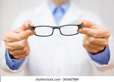 optometrist giving new glasses