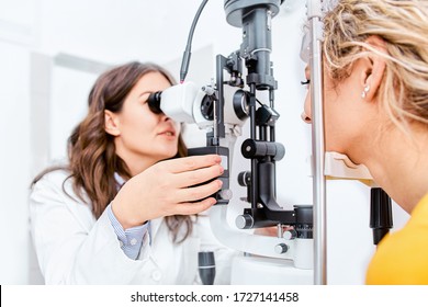 Optometrist giving Slit lamp examination of the eyes in ophthalmology clinic