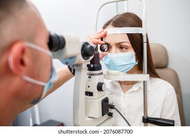 An optometrist at his clinic studies vision. Ophthalmology, medical diagnostics.