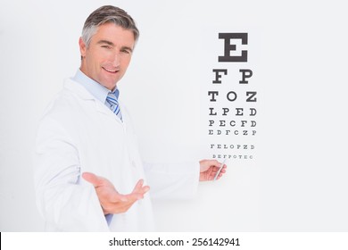 Optometrist Looking At Camera In Medical Office