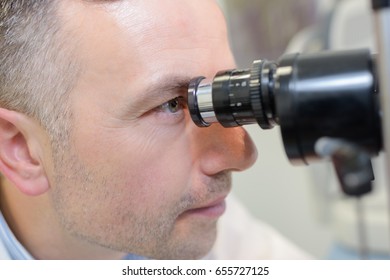 Optometrist Performing Visual Field Test