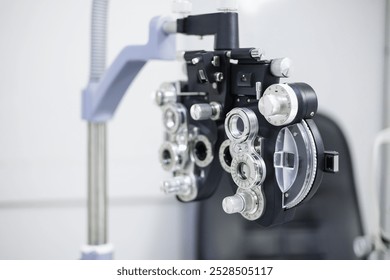 Optometrist phoropter optical correcting device tools and equipment use to diagnose, examine and treat patients eyes optical vision. Professional specialist optician eye tool. - Powered by Shutterstock