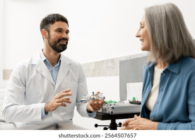 Optometrist presenting various trial frames to a smiling senior woman during a medical consultation in an ophthalmology clinic, fostering trust and comfort in the eye care process