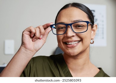 Optometrist Smiling While Adjusting Eyeglasses in Modern Office Setting - Powered by Shutterstock