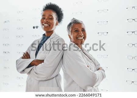 Optometry, healthcare and portrait of optometrists in a clinic after optic consultation or eye test. Leadership, ophthalmology and team of women opticians standing with crossed arms in optical store.