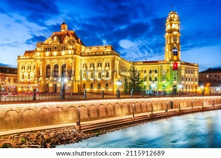 Oradea, Romania. Beautiful twilight with Cris River and the City Hall.
