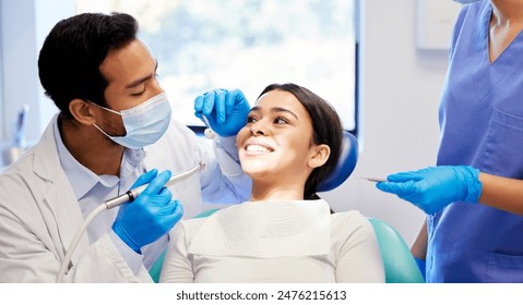 Oral care, dentist and procedure with patient for health, wellness and teeth whitening in practice. Happy woman, ppe and dental specialist with tools for consultation, cleaning and filling on chair - Powered by Shutterstock