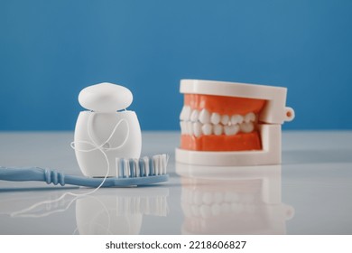 Oral Hygiene Theme. Plastic Model Of Jaw And Dental Care Products.