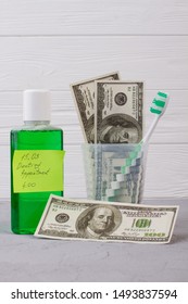 Oral Hygiene Tools, Money And Dentist Appointment Reminder. Mouthwash Bottle, Card With Inscription Dentist Appointment And American Dollars Banknotes.