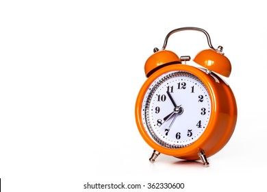 Orange alarm clock, isolated on white 