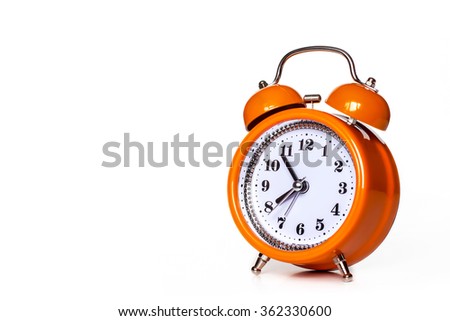 Orange alarm clock, isolated on white 