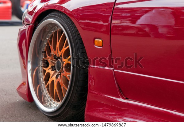 orange alloy wheels. racing red car. drift, sports\
car. extreme sport