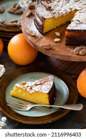 Orange Almond Cake On A Wooden Cake Stand