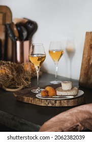 Orange Or Amber Wine In Wineglass And Appetizers Snacks