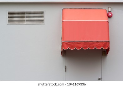 Orange Awning Over Steel Door