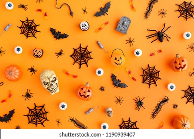 Orange background with collection of Halloween objects overhead view - Powered by Shutterstock