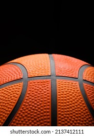 Orange Basketball On A Black Background. Macro Shot. There Are No People In The Photo. There Is Free Space To Insert. Sports, Sports Games, Basketball Championship.