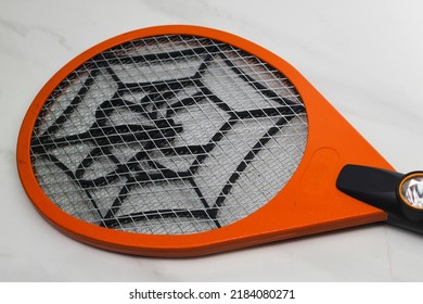 Orange And Black Mosquito Racket