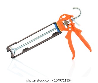 Orange And Black Silicone Glue Gun Isolated On White Background With Shadow Reflection. Sealant Or Caulking Gun On A White Backdrop.  Faithfull Heavy Duty Mastic Gun. Resin Applicator.