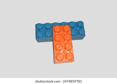 A orange and blue interlocking plastic blocks.