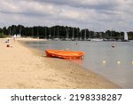 Orange boat on the shore of Lake Tarnobrzeg