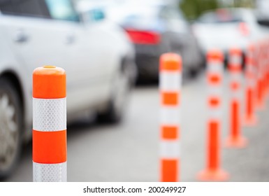 Orange Bollard On The Road. Traffic Jam.