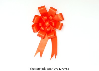 Orange Bow Ribbon On White Background.
