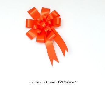 Orange Bow Ribbon On White Background.