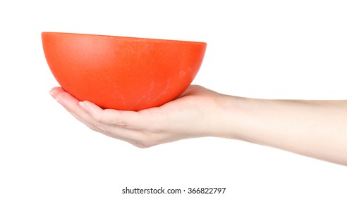 Orange Bowl on a female hand on a white background