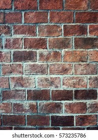 orange brick wall For use as a background image with dark tones - Shutterstock ID 573235786