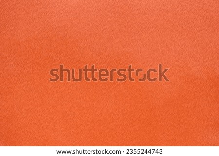 Orange Brown Artificial Leather Texture Background, close up shot and free space for text present
