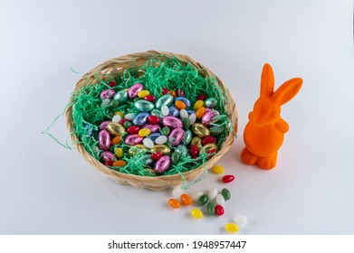 Orange Bunny With A Filled Easter Basket And Sweet Eggs